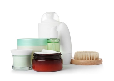 Photo of Different body care products and brush on white background