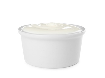 Photo of Bowl with sour cream on white background