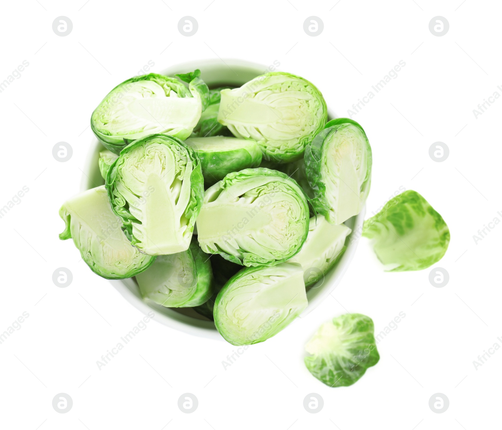 Photo of Fresh Brussels sprouts in bowl isolated on white, top view