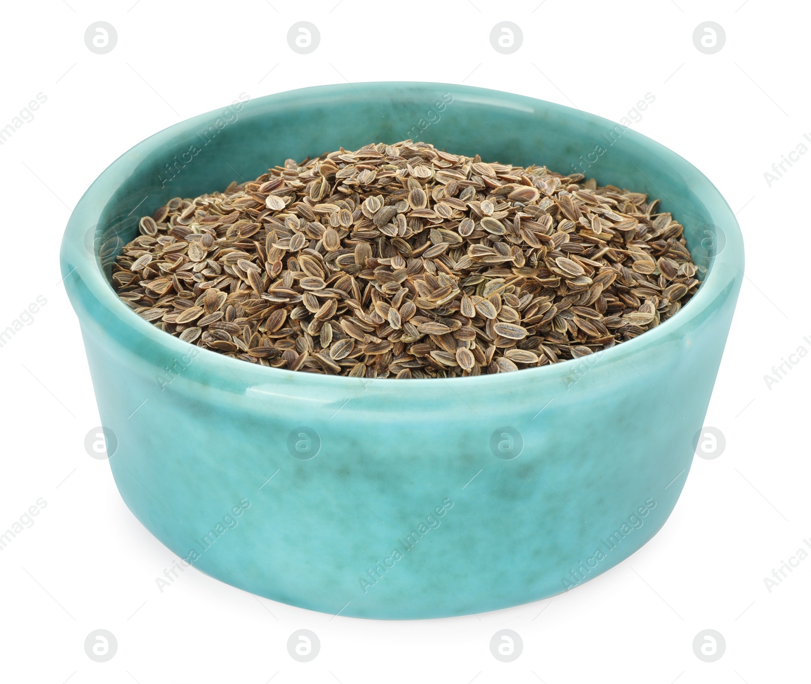 Photo of Bowl of dry dill seeds isolated on white