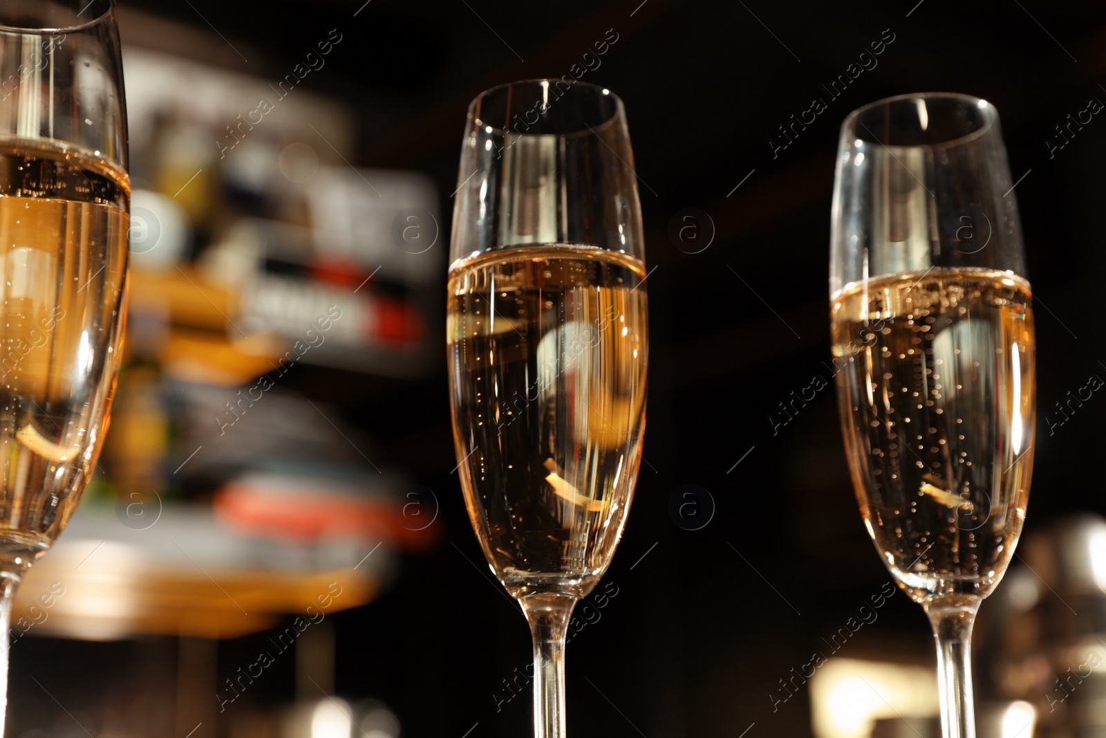 Photo of Glasses of champagne in bar, low angle view