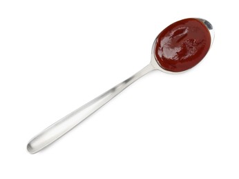 Photo of Tasty barbecue sauce in spoon isolated on white, top view