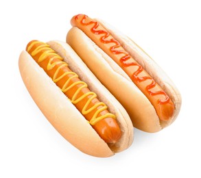 Photo of Tasty hot dogs with ketchup and mustard isolated on white