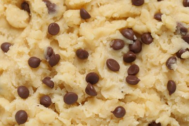 Raw dough for chocolate chip cookies as background, top view