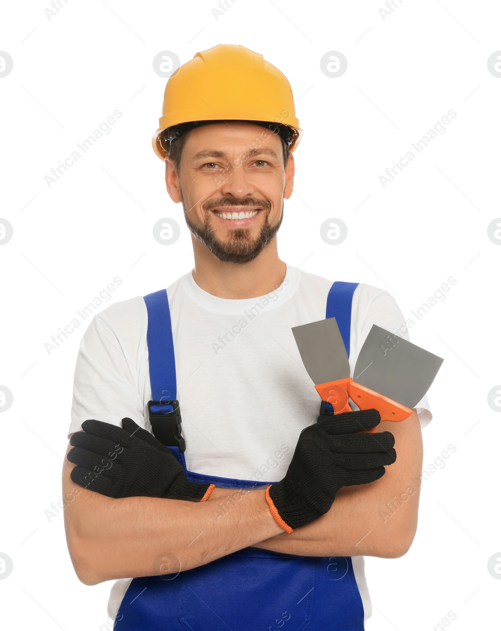 Photo of Professional worker with putty knives in hard hat on white background