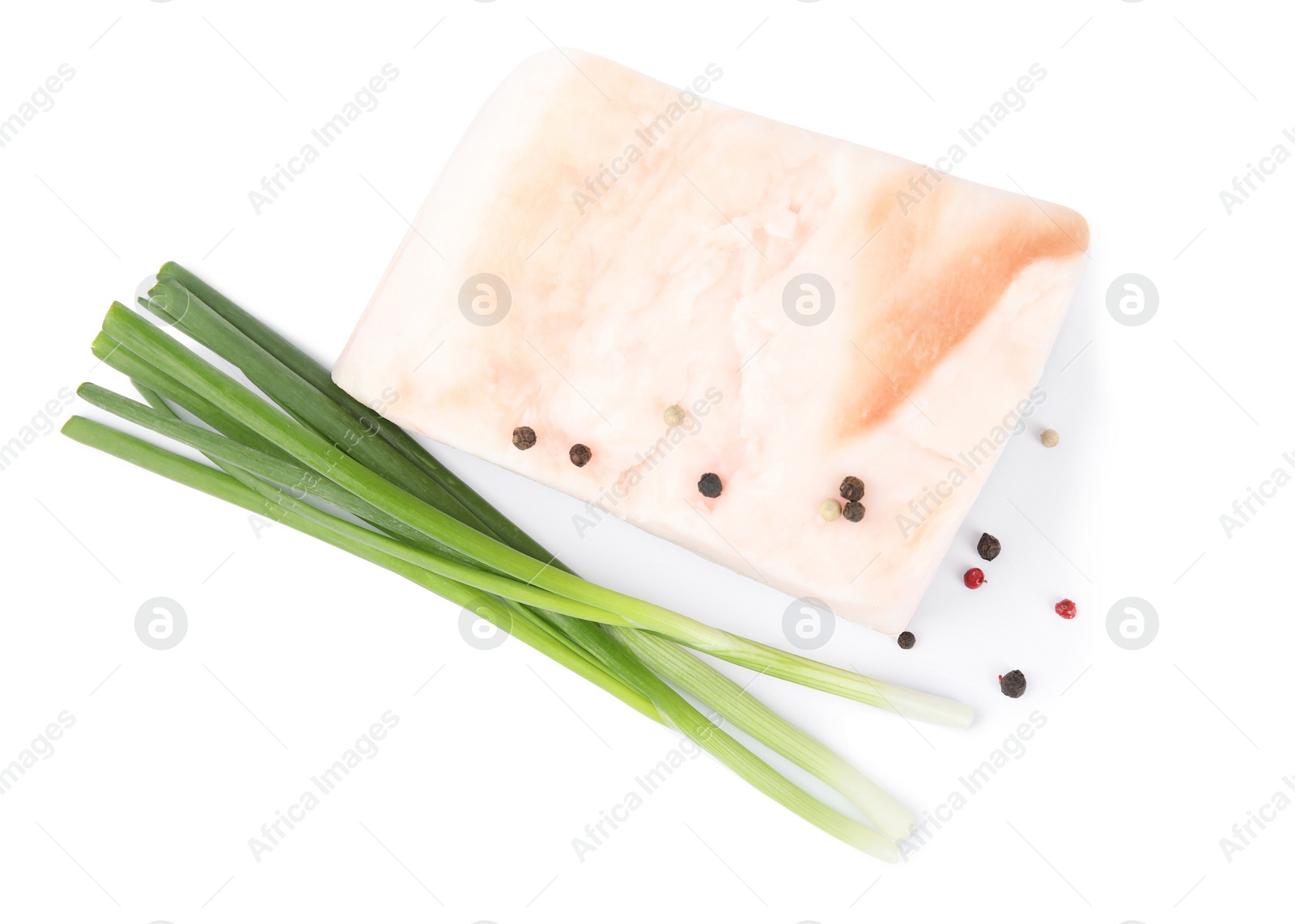 Photo of Piece of pork fatback with pepper and onions isolated on white, top view