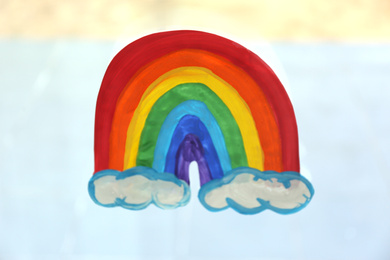 Photo of Picture of rainbow on window glass, closeup. Stay at home concept