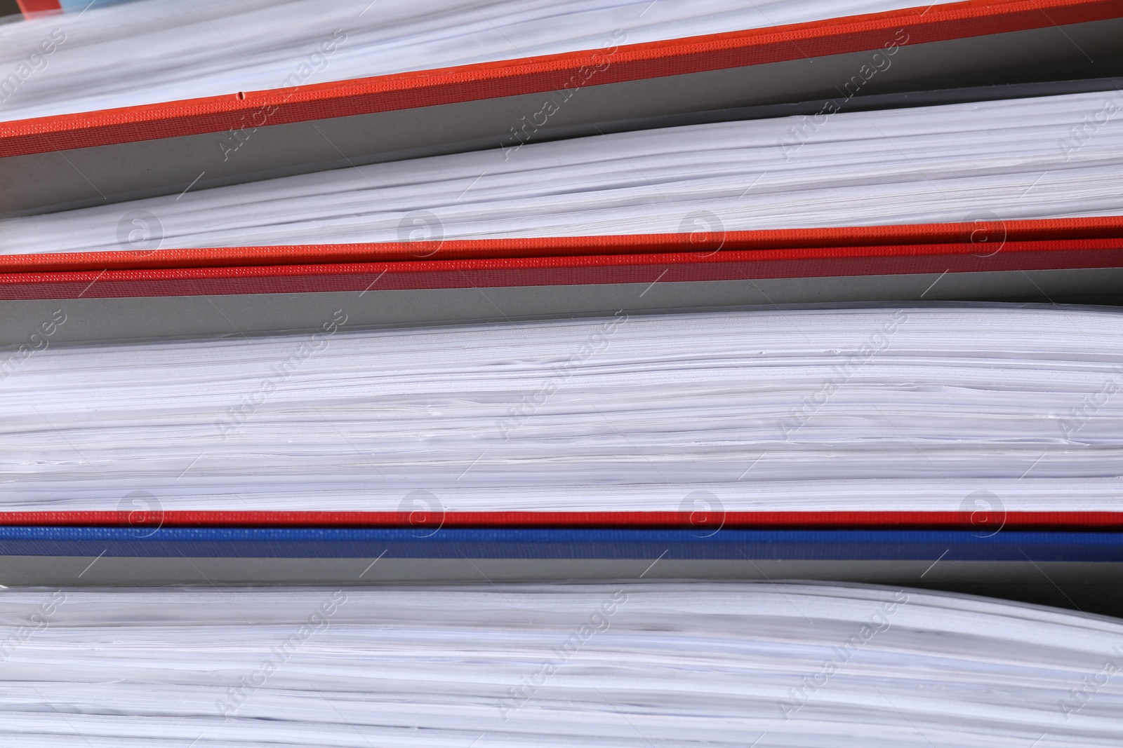 Photo of Colorful binder office folders as background, closeup