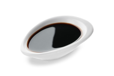 Photo of Dish of soy sauce on white background