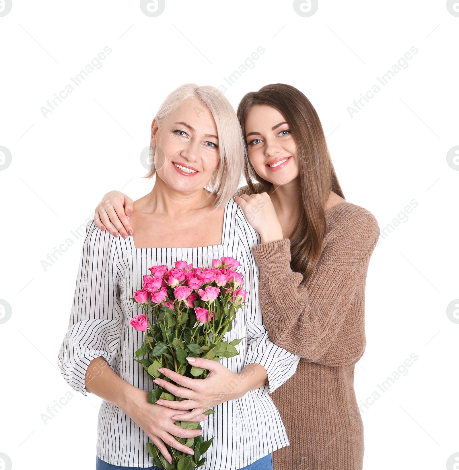 Photo of Young daughter congratulating her mature mother on white background. Happy Women's Day