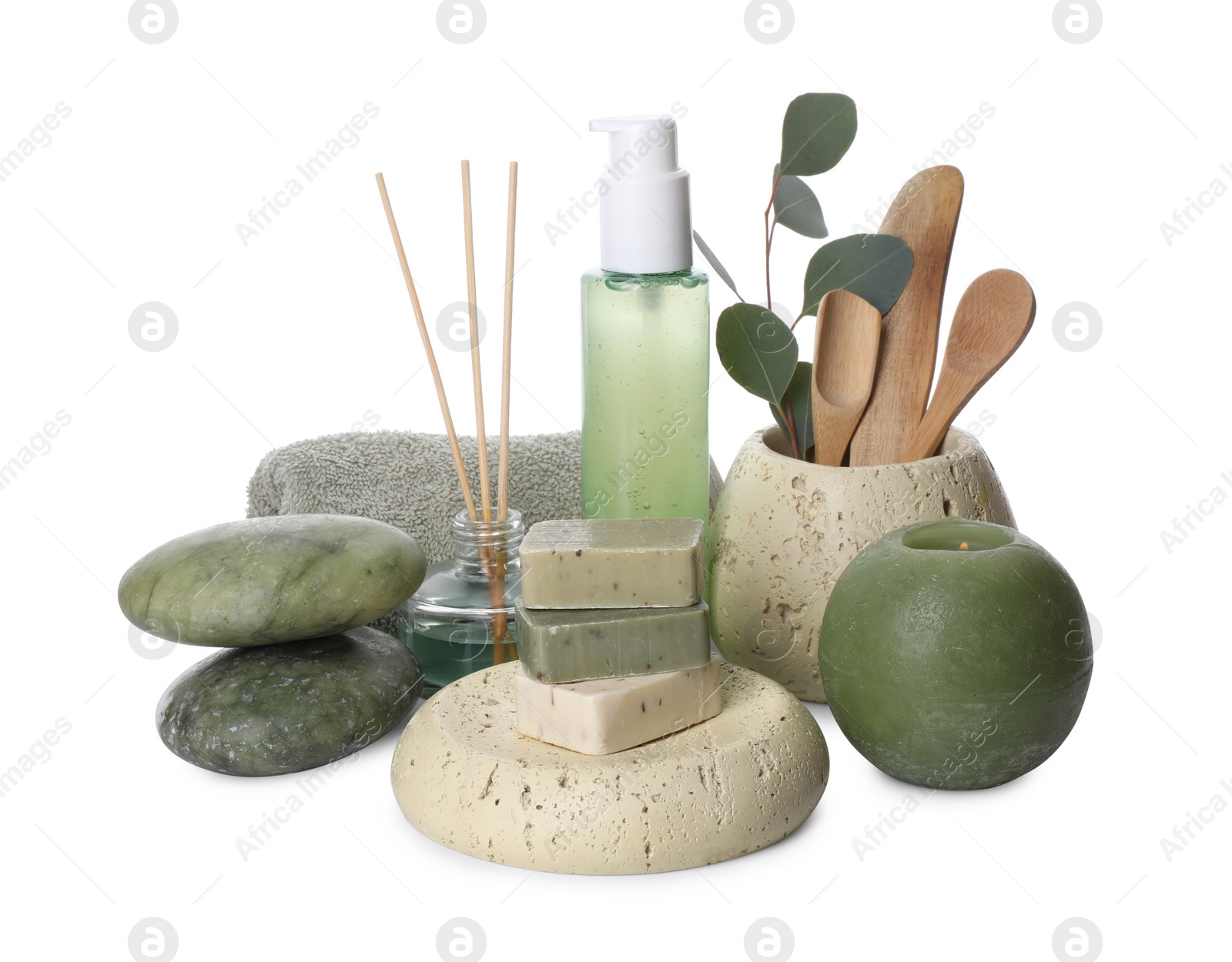 Photo of Composition with spa products, reed air freshener, candle and eucalyptus branch isolated on white