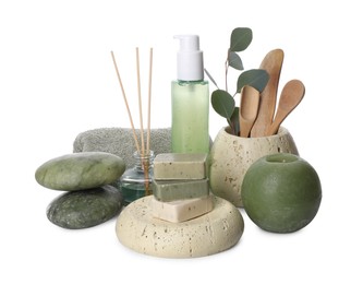 Photo of Composition with spa products, reed air freshener, candle and eucalyptus branch isolated on white