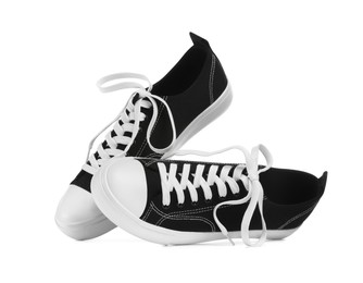 Photo of Pair of black classic old school sneakers isolated on white