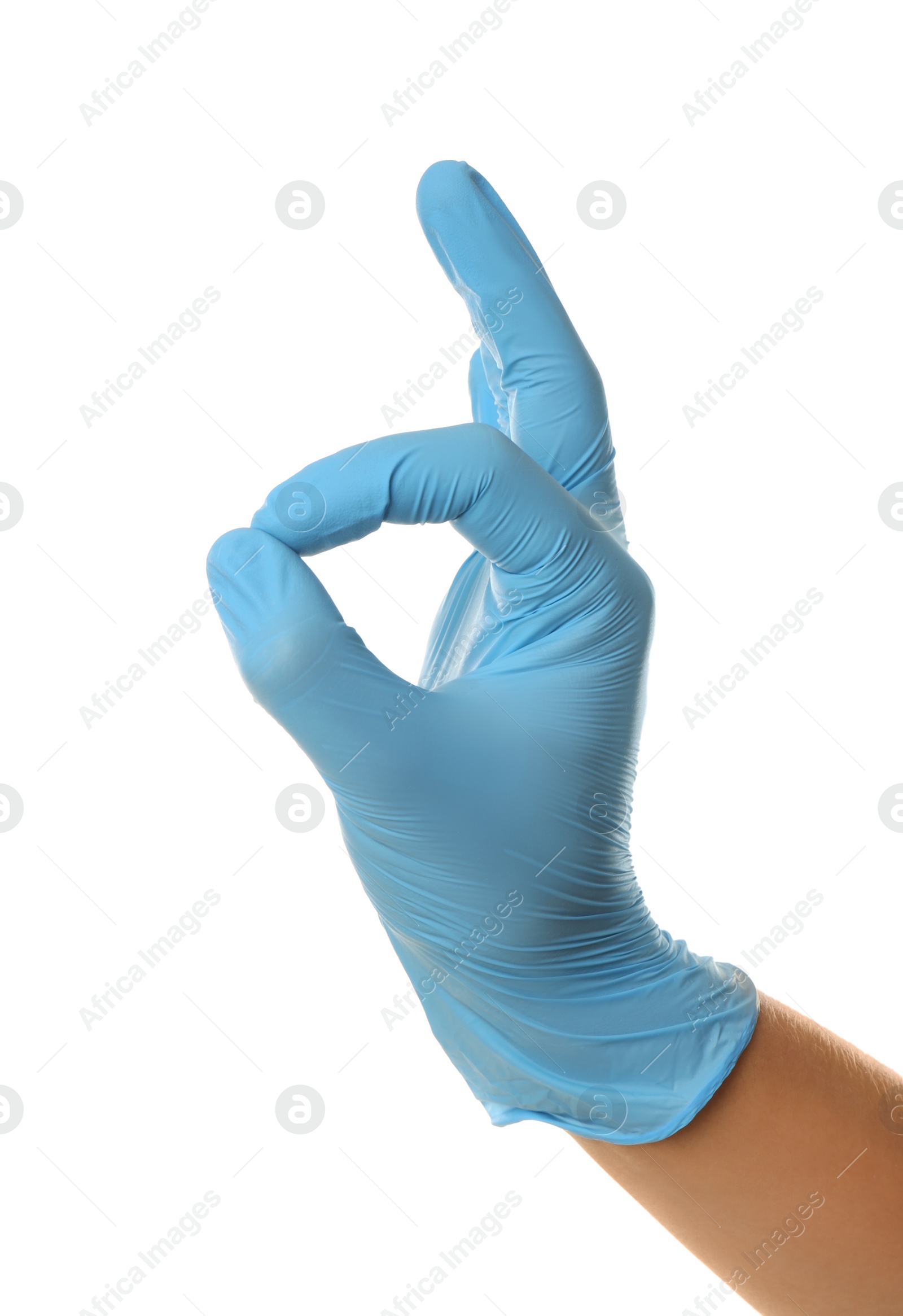 Photo of Person in blue latex gloves showing okay gesture against white background, closeup on hand