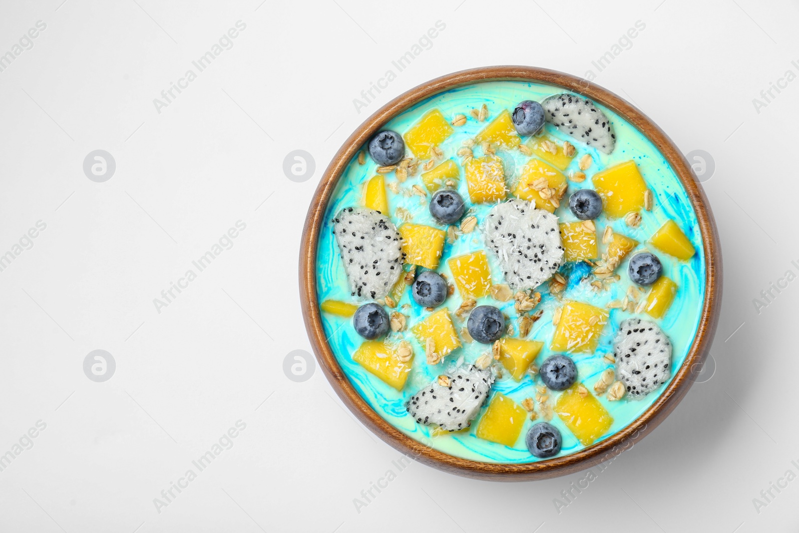 Photo of Delicious smoothie bowl with fresh fruits, blueberries and oatmeal on white background, top view. Space for text