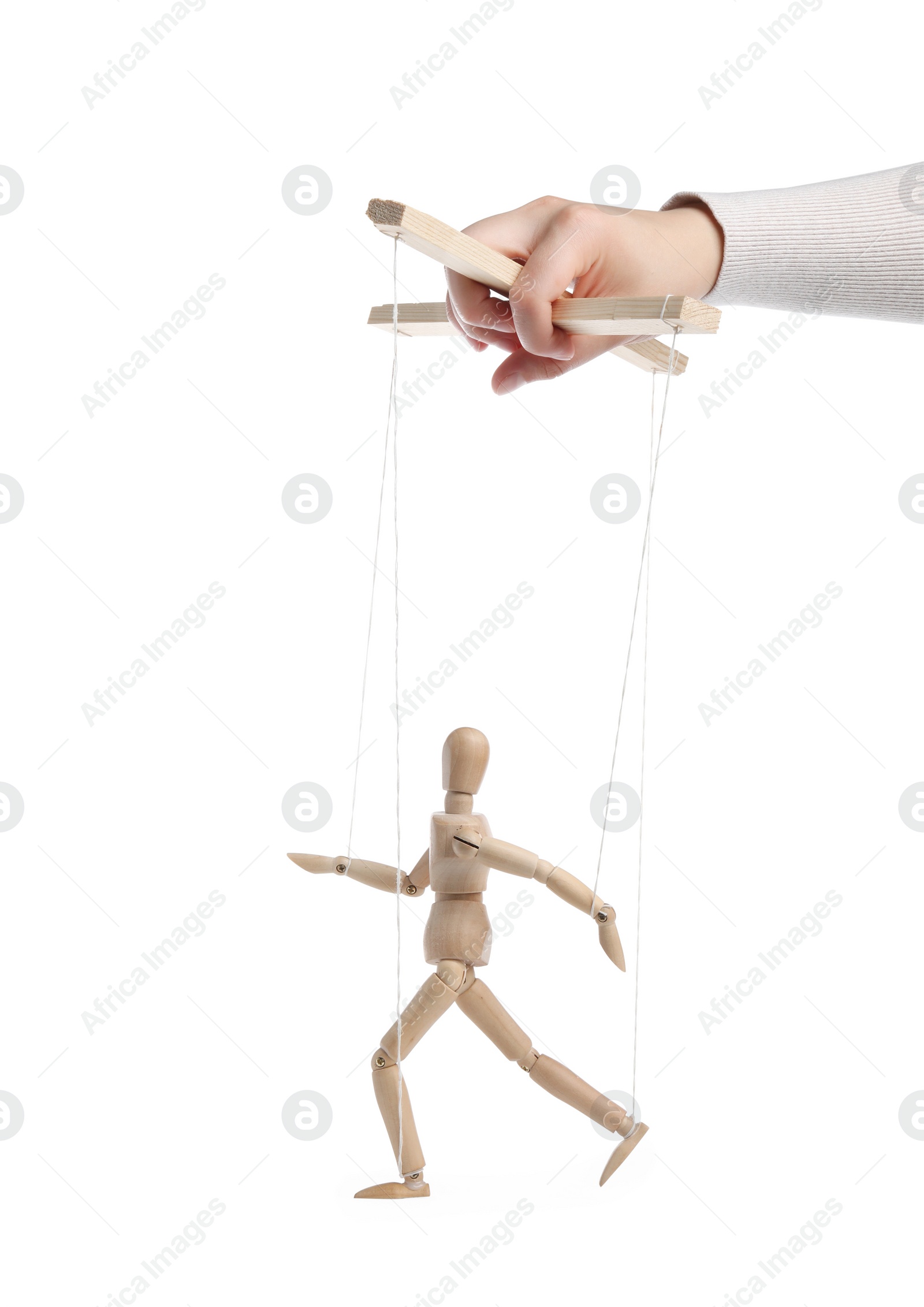 Photo of Woman pulling strings of puppet on white background, closeup