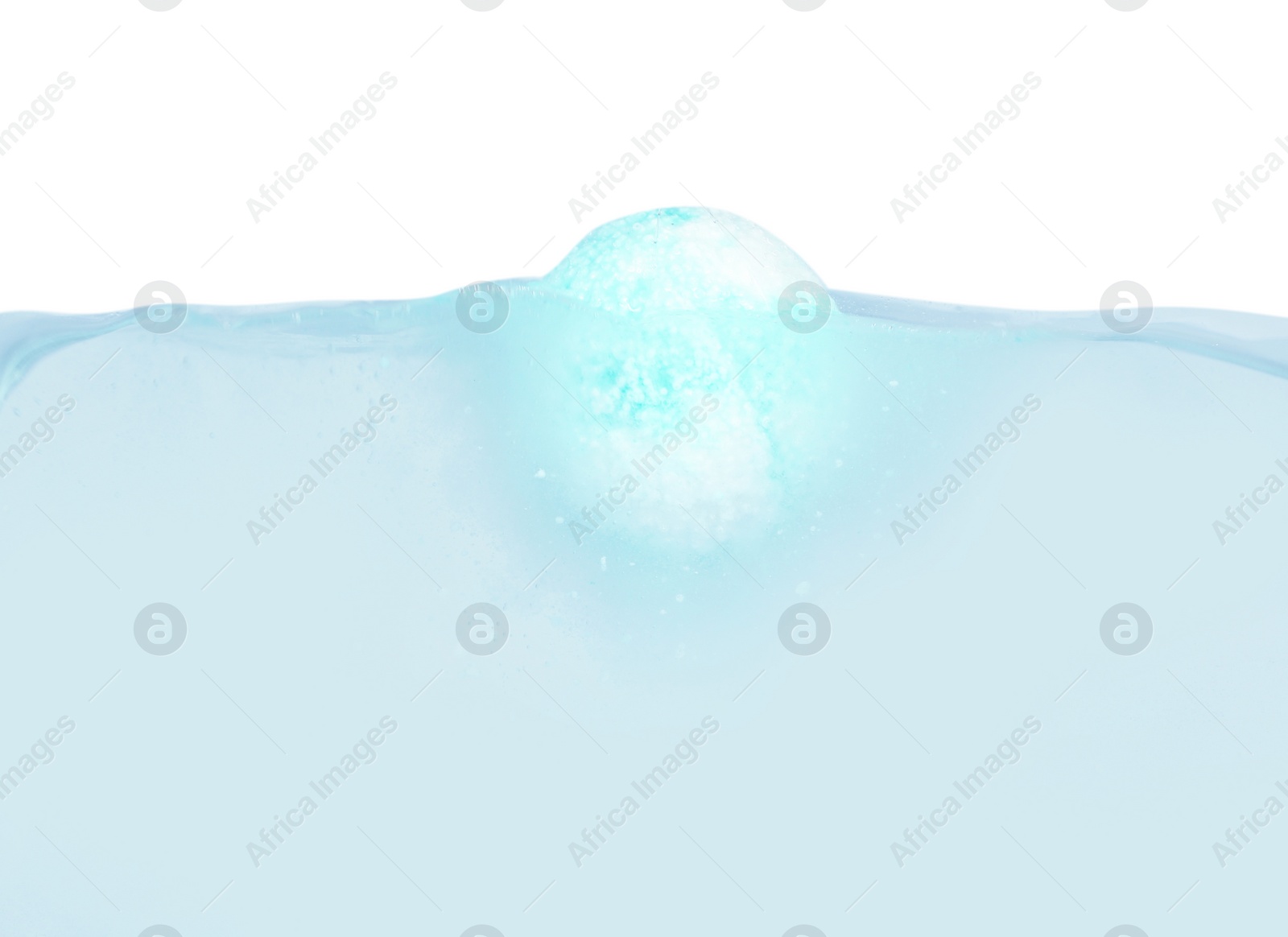 Photo of Bath bomb in water on white background