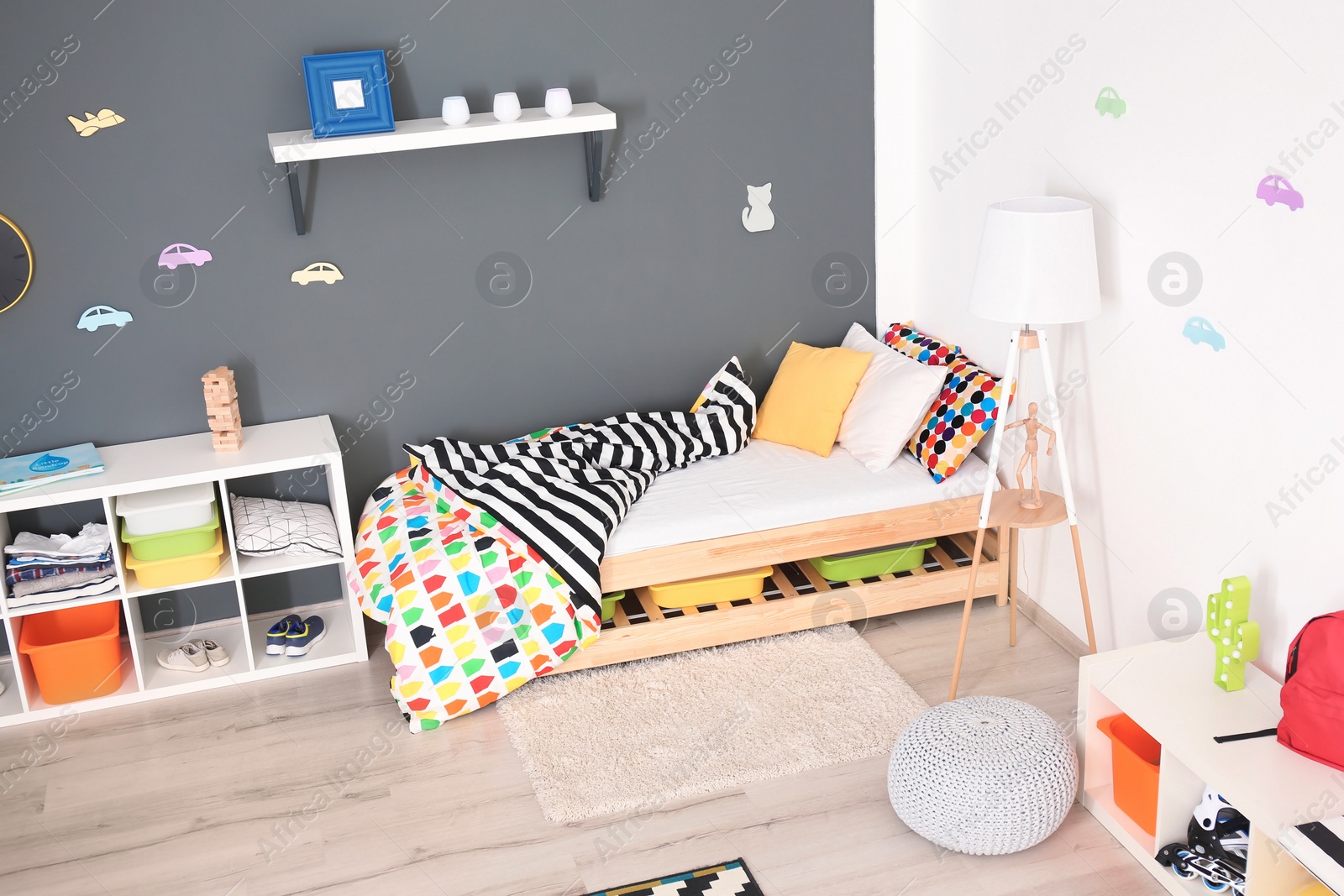 Photo of Modern room interior with comfortable bed for child