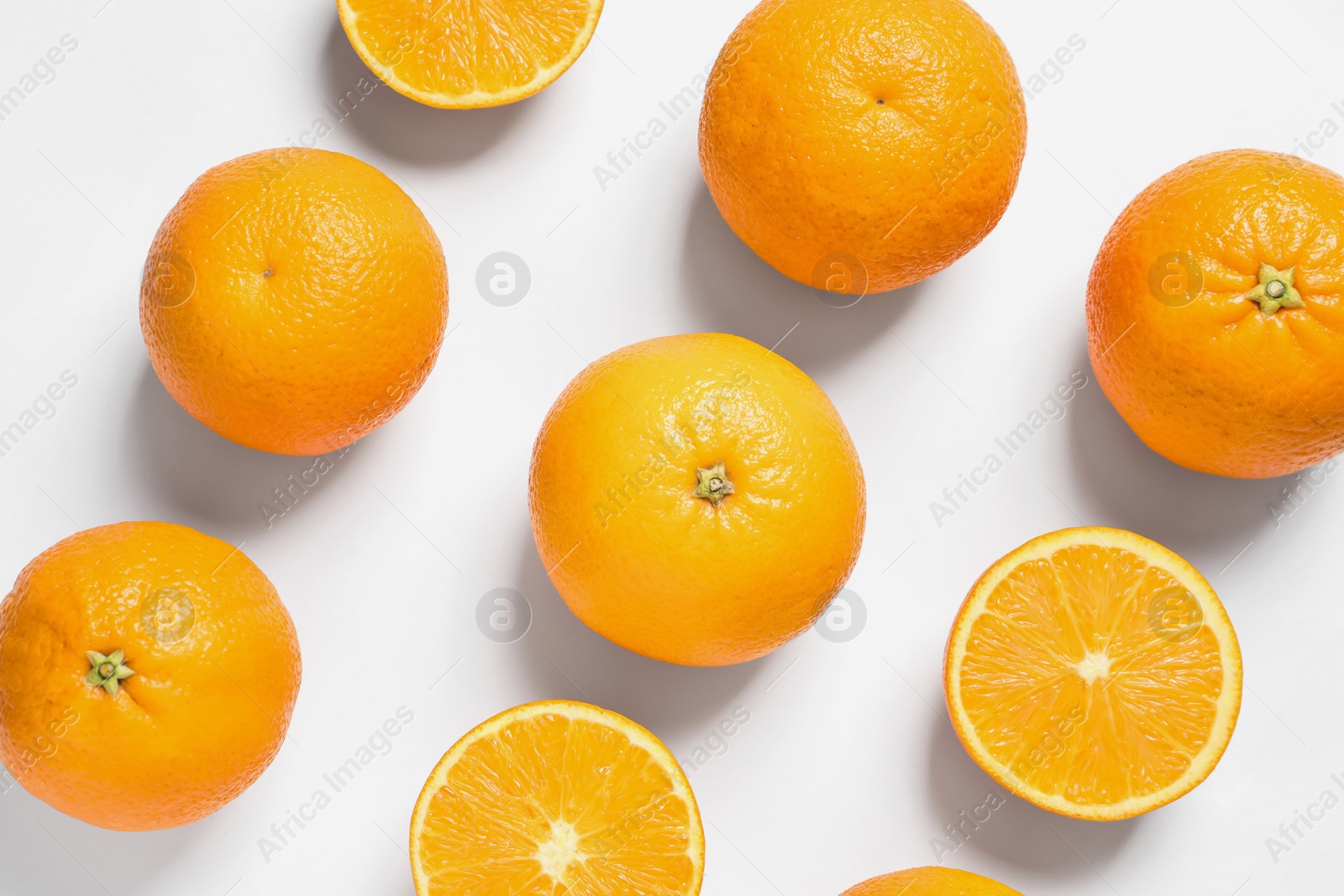 Photo of Composition with ripe oranges on white background, top view