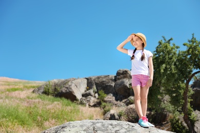 Photo of Little girl outdoors on sunny day. Summer camp