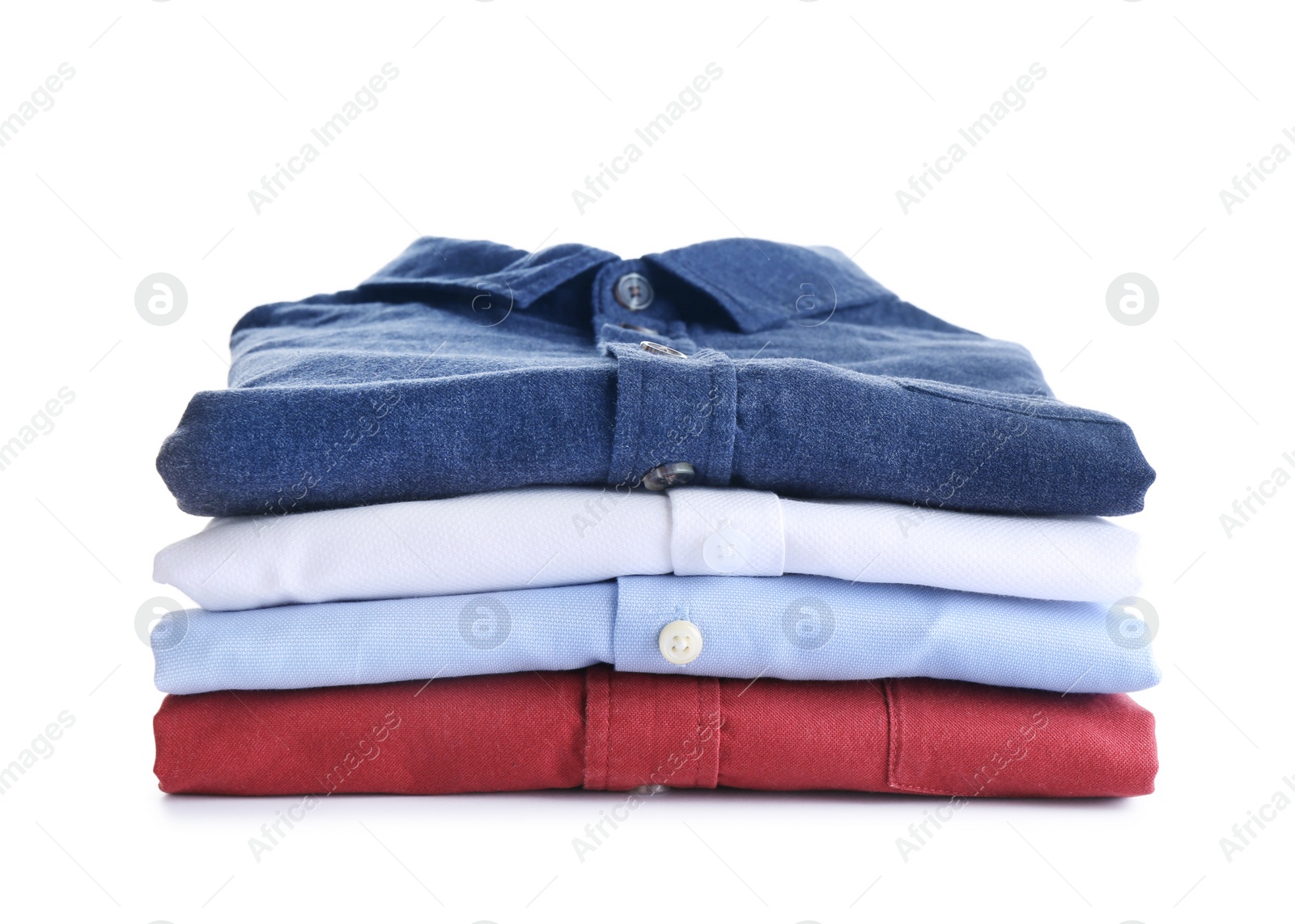 Photo of Pile of ironed clothes isolated on white