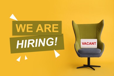 Image of We`re hiring! Comfortable office chair with sign VACANT on yellow background