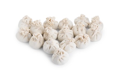 Many uncooked khinkali (dumplings) isolated on white. Georgian cuisine