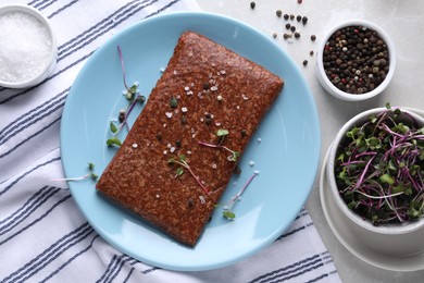 Fresh raw vegan mince and spices on white table, flat lay