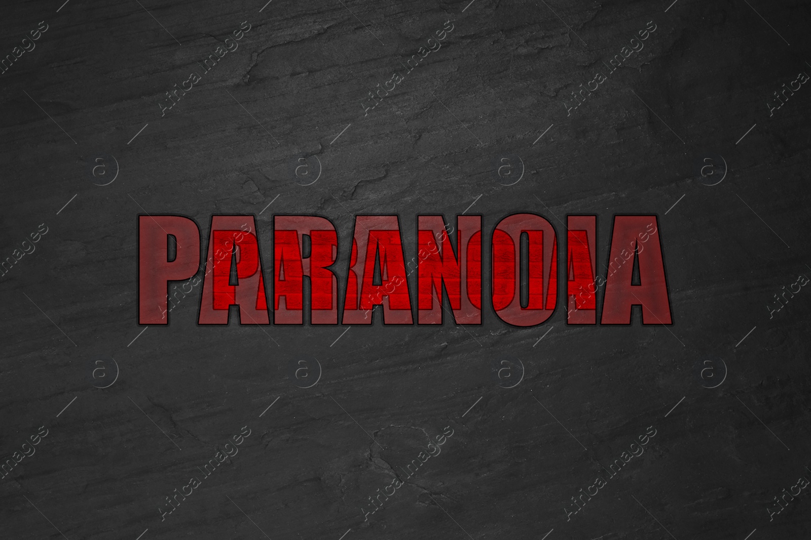 Image of Mental disorder. Words Paranoia on black stone background