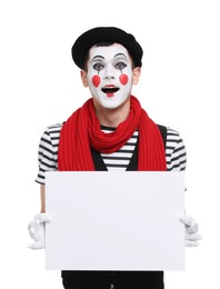 Photo of Funny mime artist with blank sign on white background