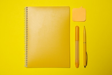 Photo of Different school stationery on yellow background, flat lay