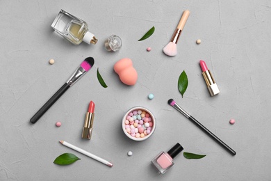 Flat lay composition with cosmetic products on grey background