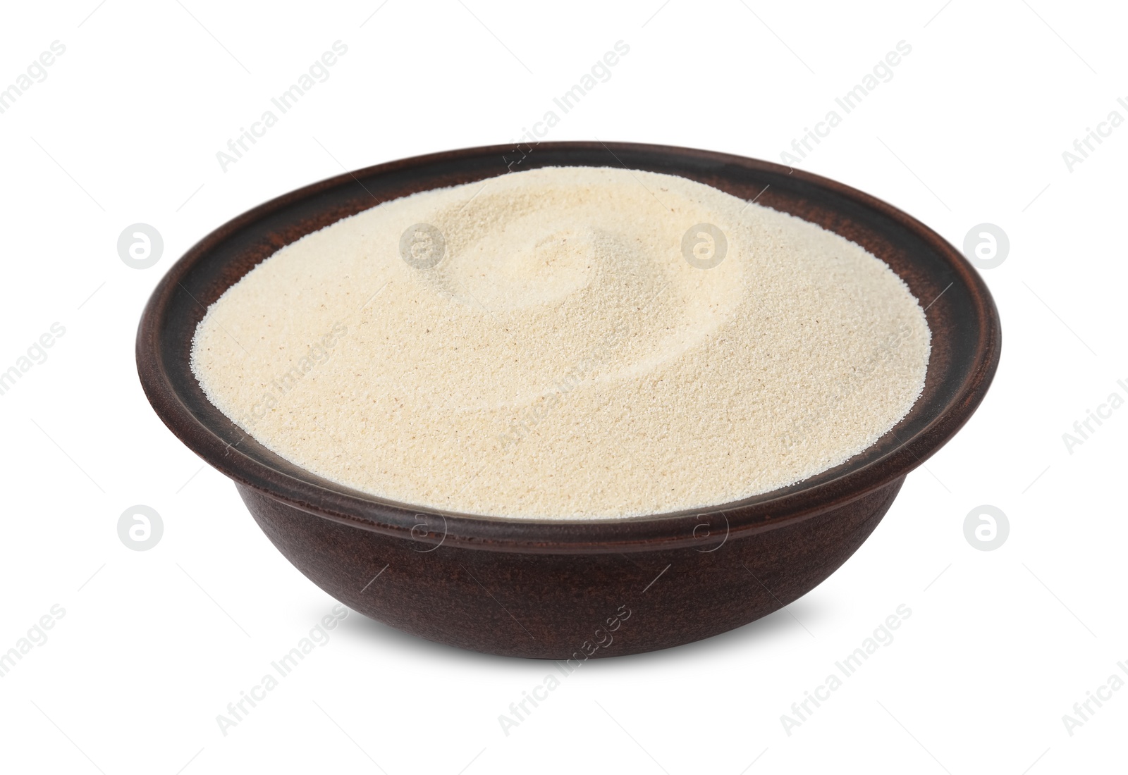 Photo of Bowl of uncooked organic semolina isolated on white