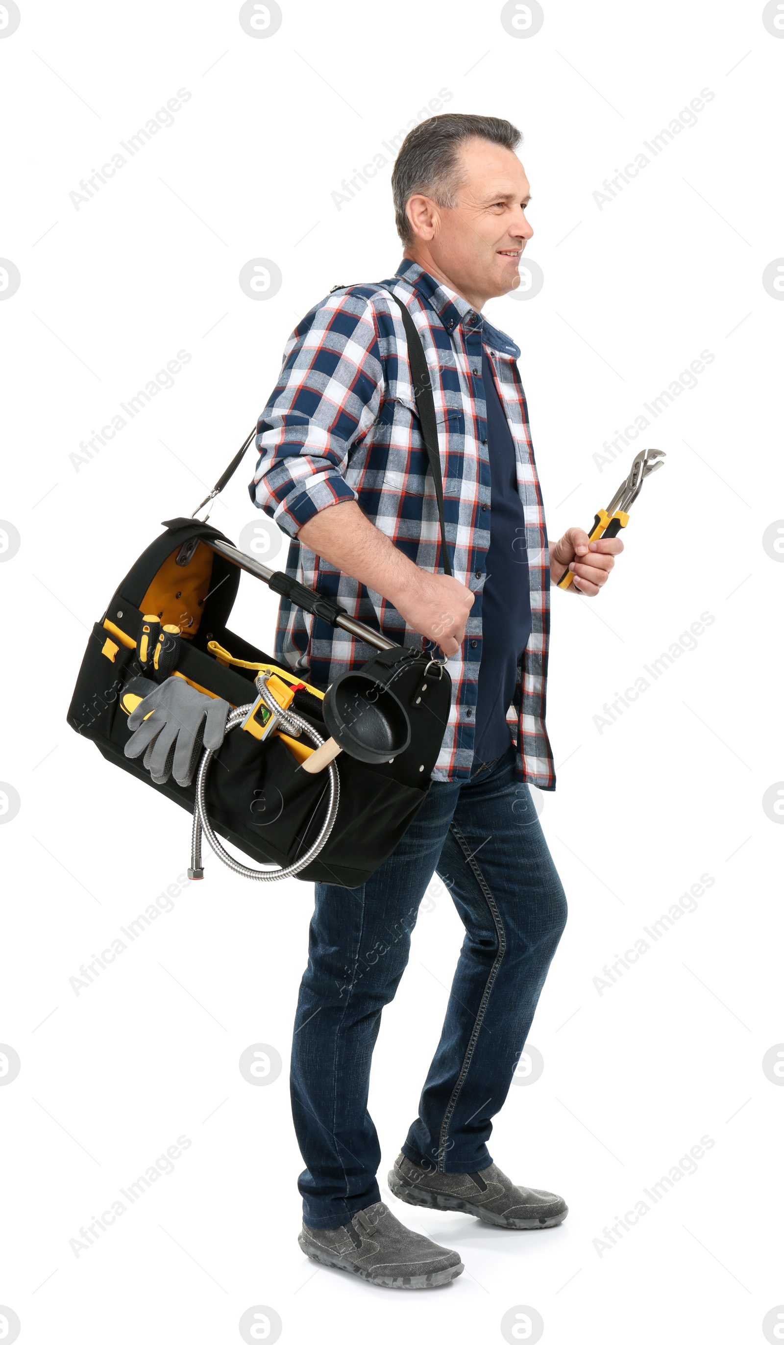 Photo of Mature plumber with tool bag on white background