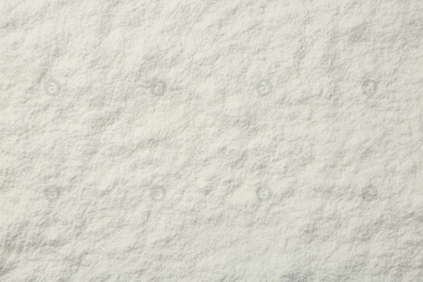 Photo of Pile of organic flour as background, top view