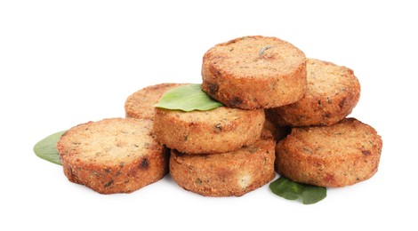 Photo of Delicious vegan cutlets and spinach on white background