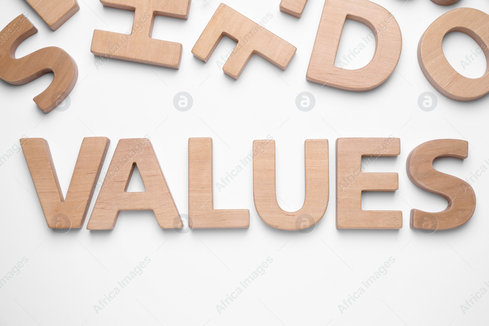 Photo of Word VALUES made of wooden letters on white background, top view