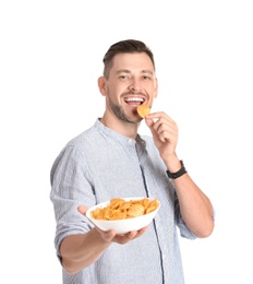 Photo of Man eating potato chips on white background