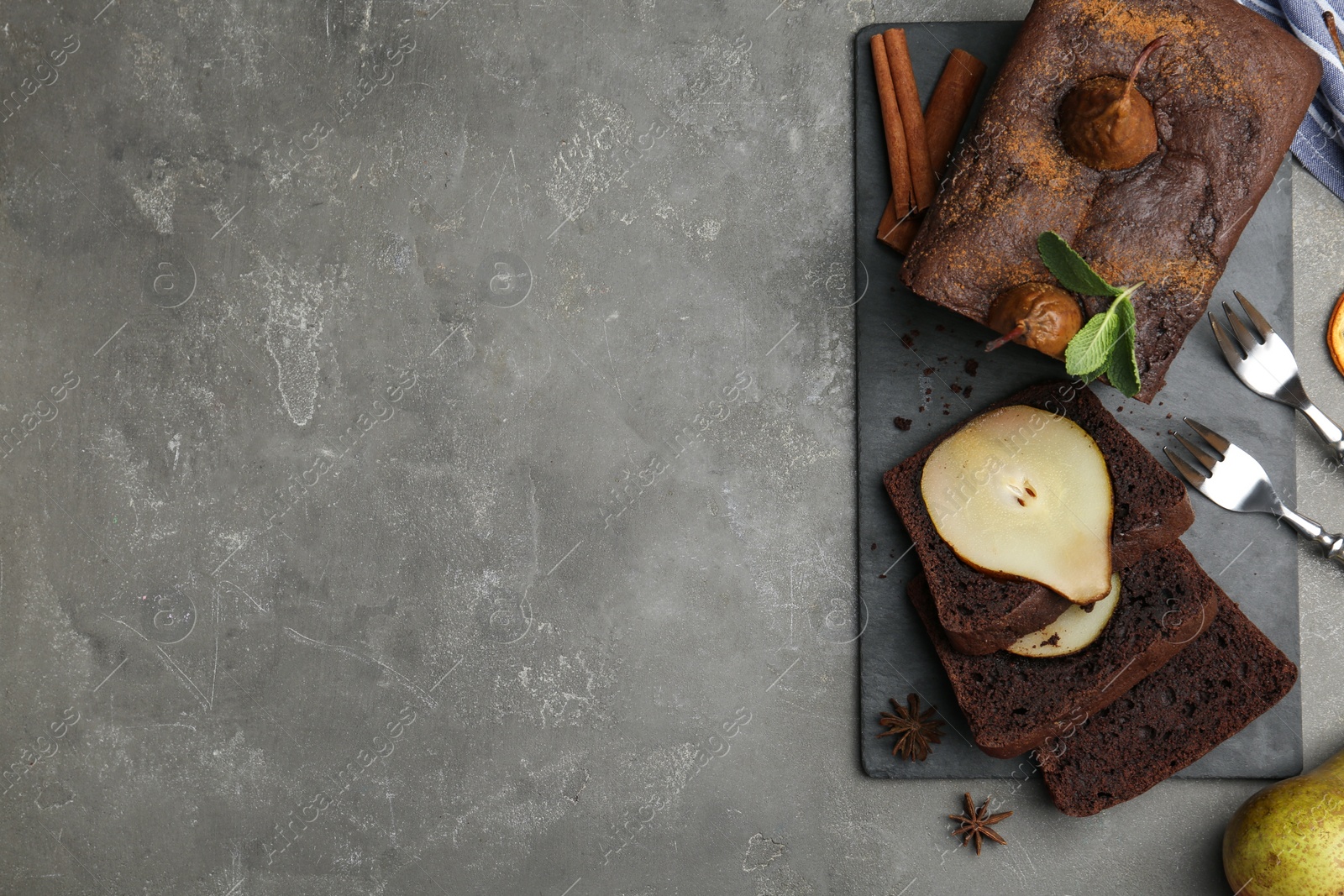 Photo of Flat lay composition with tasty pear bread on grey table, space for text. Homemade cake