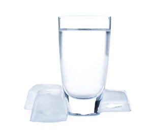 Vodka in shot glass and ice cubes on white background