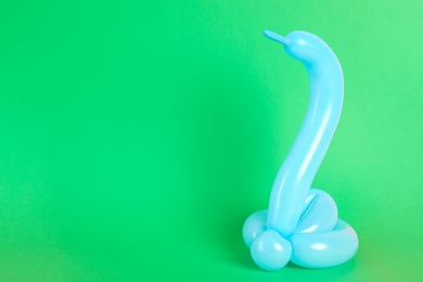 Snake figure made of modelling balloon on color background. Space for text