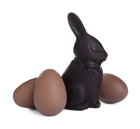 Photo of Chocolate Easter bunny and eggs on white background