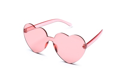 Stylish heart shaped glasses on white background