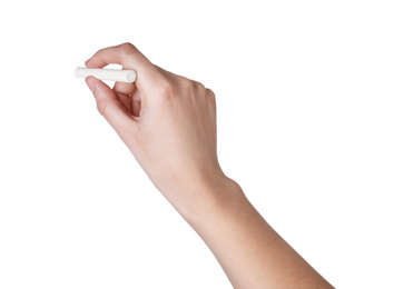 Photo of Woman holding piece of chalk isolated on white, closeup