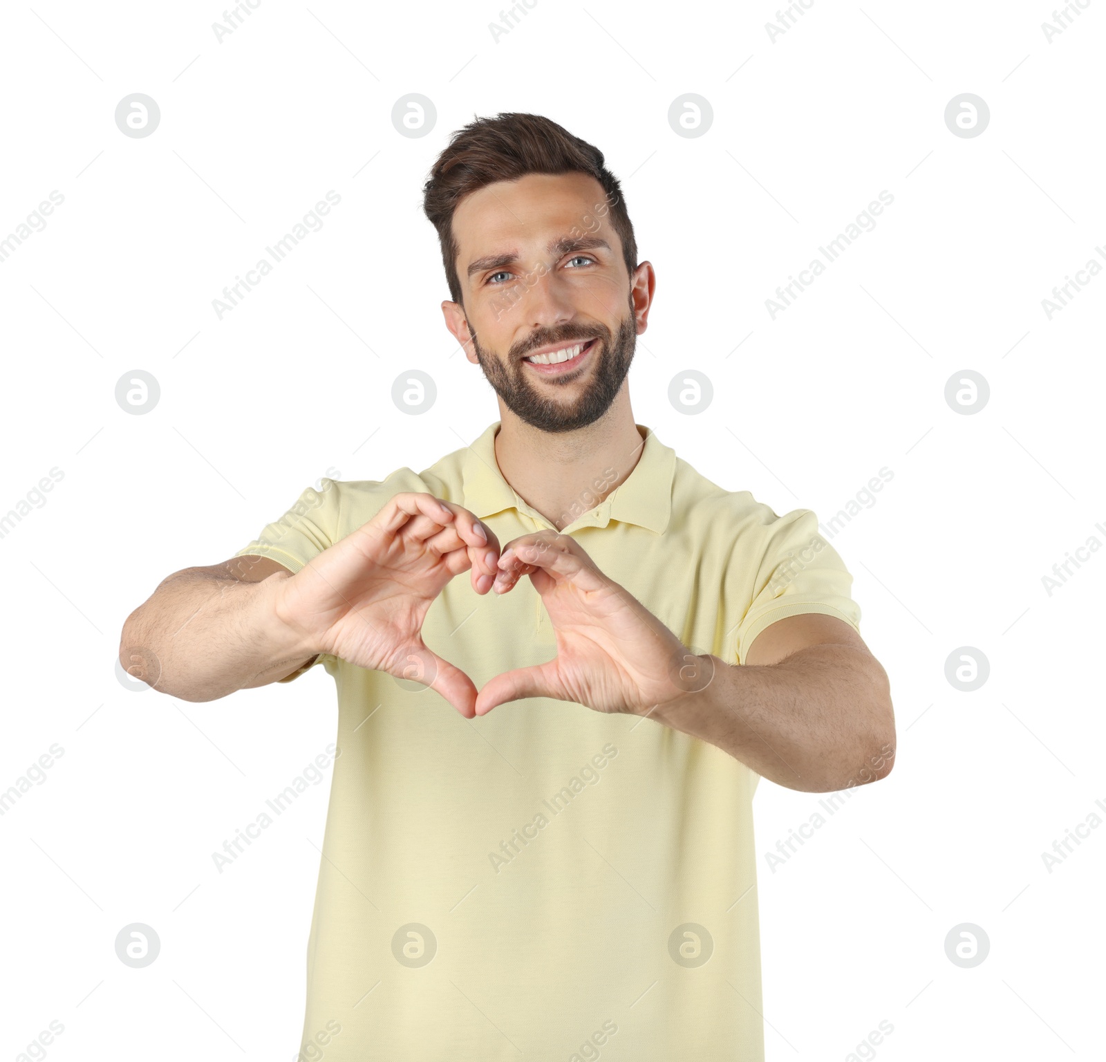 Photo of Happy man making heart with hands on white background