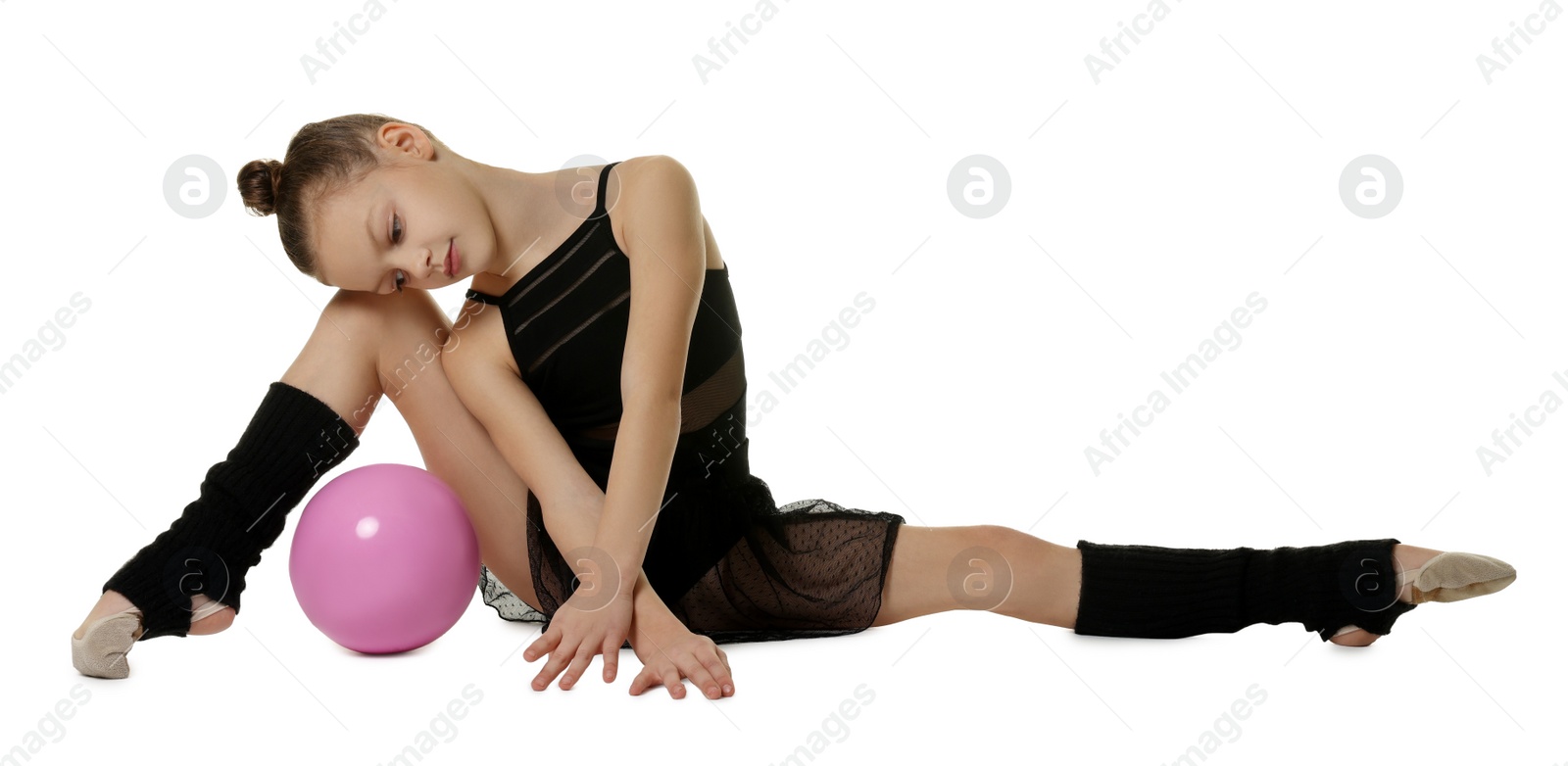 Photo of Cute little gymnast doing with ball on white background