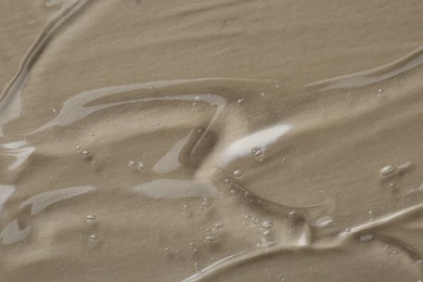 Photo of Cosmetic serum on beige background, above view