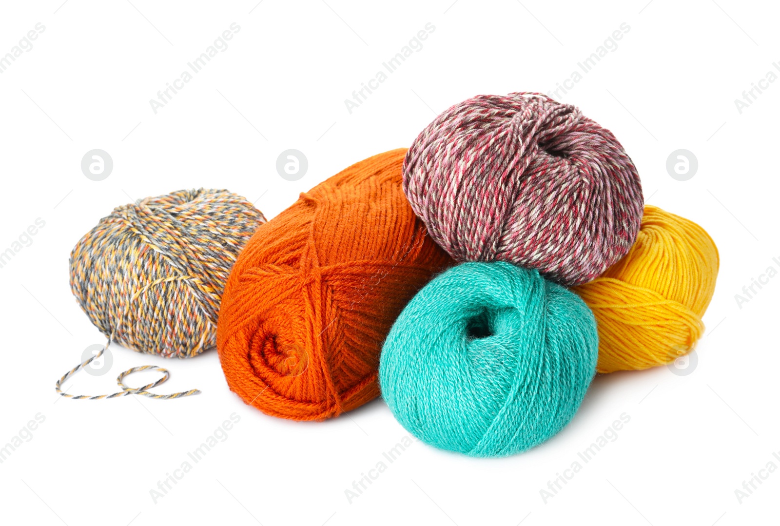 Photo of Different balls of woolen knitting yarns on white background