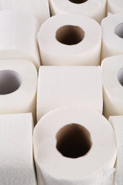 Photo of Many soft toilet paper rolls as background, closeup