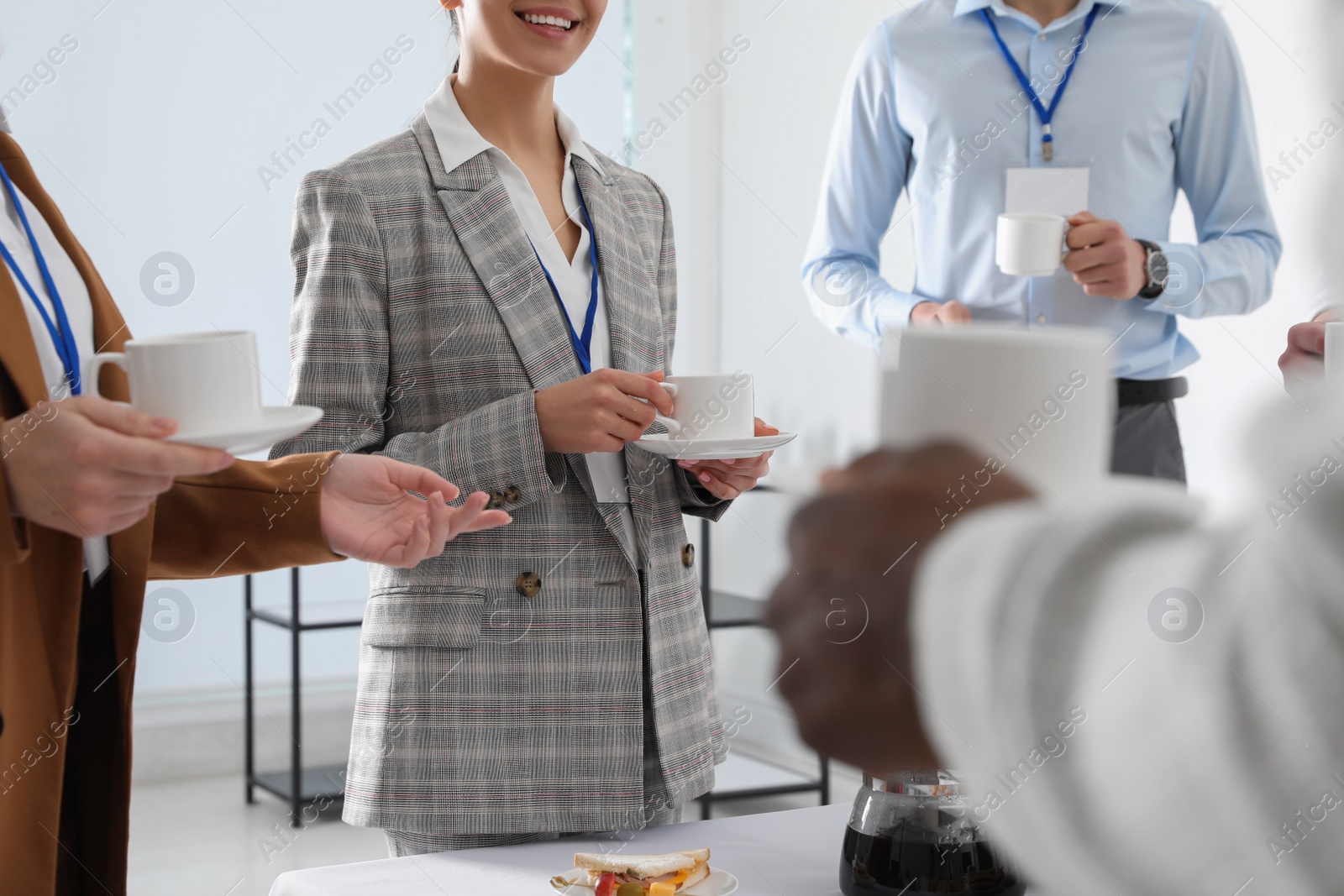 Photo of Group of people during coffee break, closeup